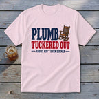 Pink t-shirt with "PLUMB TUCKered OUT AND IT AIN'T EVEN DINNER" text and rocking chair icon.