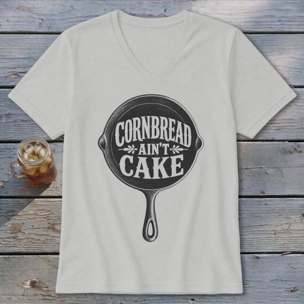 Cornbread Ain't Cake text design on a light grey v-neck t-shirt.
