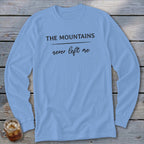 Light blue long-sleeve t-shirt with "THE MOUNTAINS never left me" graphic.