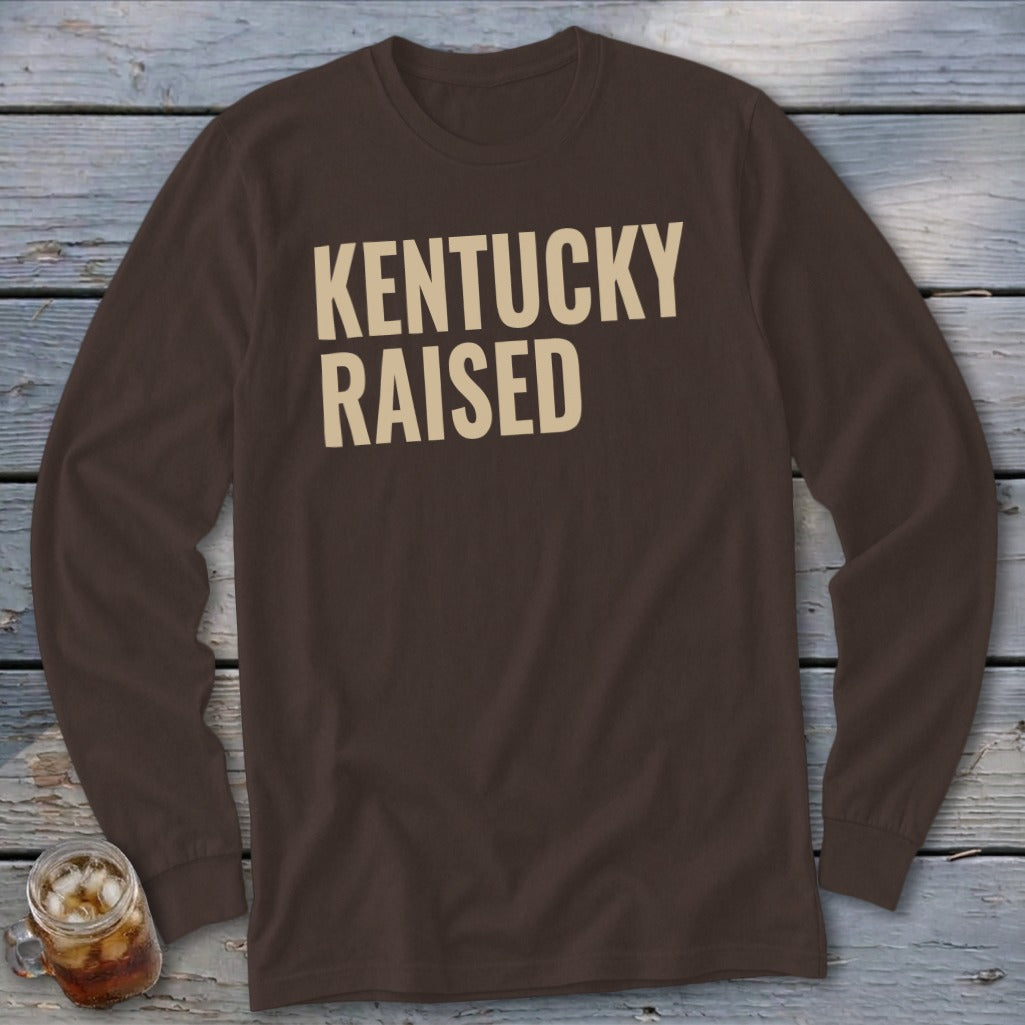 Brown long-sleeve shirt with "Kentucky Raised" text in cream.