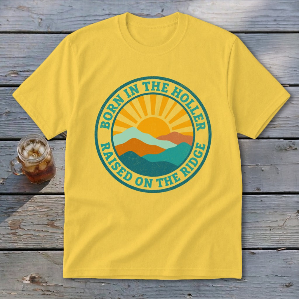 Yellow short-sleeve t-shirt with a round graphic featuring a sunrise over mountains and text.