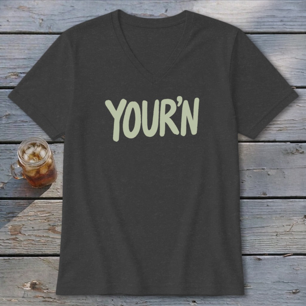 Dark v-neck t-shirt with "YOUR'N" printed in light green text.