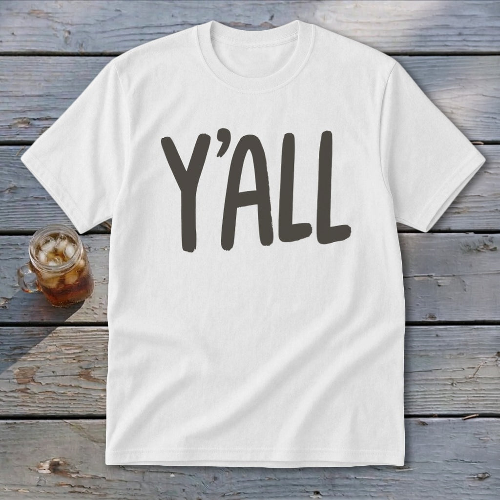 White t-shirt with large gray "Y'ALL" text, next to a glass of iced tea.