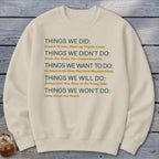 Cream sweatshirt with a list of phrases about things done, not done, wanted, and will do.