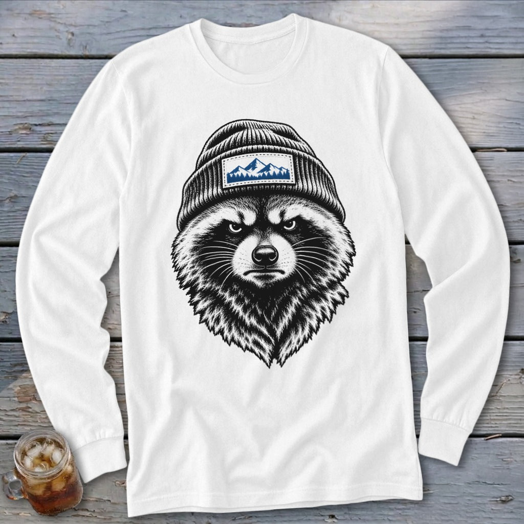 Raccoon wearing a beanie with a mountain patch on white long-sleeve shirt.