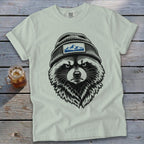 T-shirt with black and white graphic of a raccoon wearing a beanie with mountain patch.