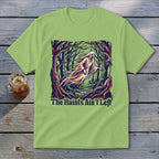 Light green t-shirt with ghost in forest graphic and text "The Haints Ain't Left".
