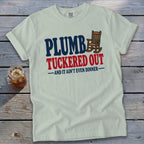 Light t-shirt with "Plumb, Tuckered Out, and it ain't even dinner" text and rocking chair graphic.