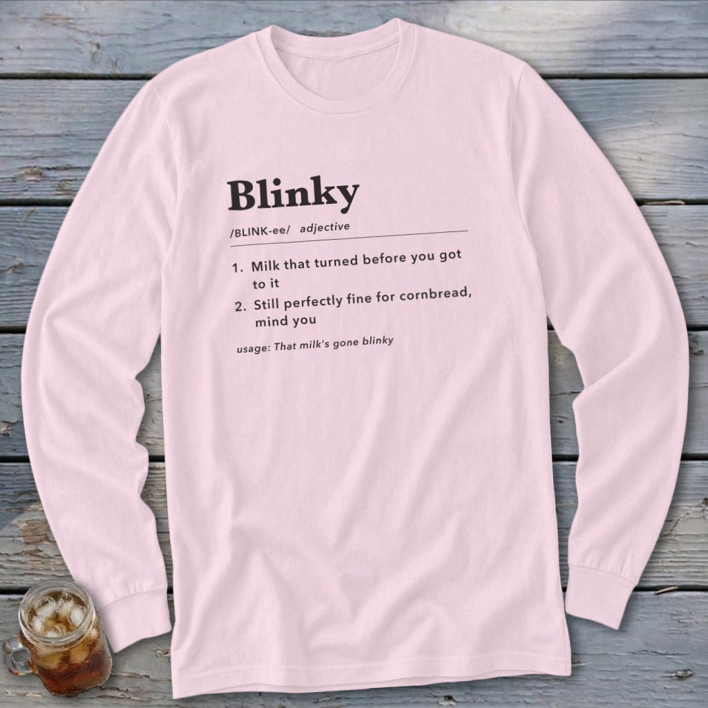 Pink long-sleeve shirt with "Blinky" definition text: adjective meaning milk turned or fine for cornbread.