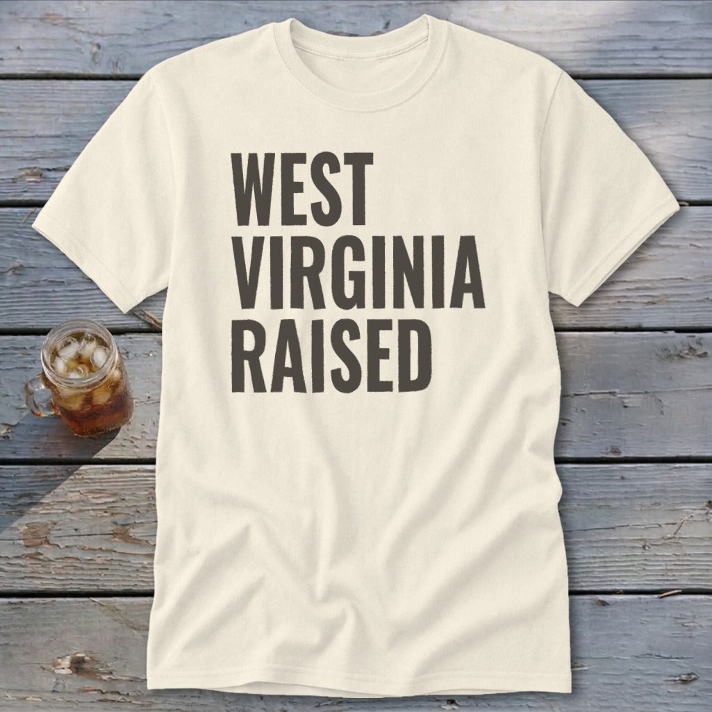 Cream t-shirt with "WEST VIRGINIA RAISED" in dark text.