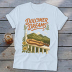 Light blue t-shirt with "Dulcimer Dreams" text and dulcimer on a railing.