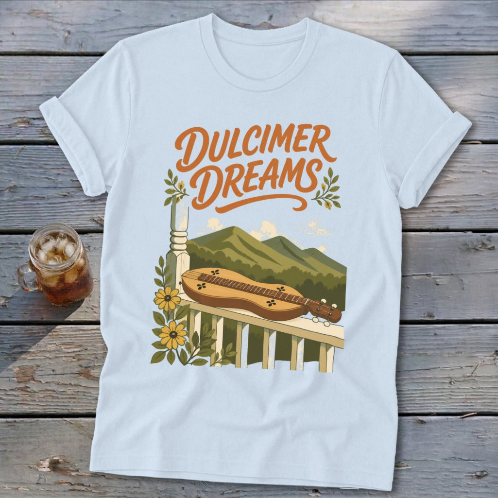Light blue t-shirt with "Dulcimer Dreams" text and dulcimer on a railing.