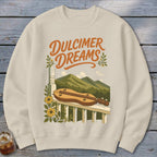 Cream sweatshirt with "Dulcimer Dreams" text and a dulcimer on a porch railing.