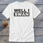A white t-shirt with the bold black text WELL I SWAN displayed across the chest.