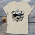 Cream t-shirt with a heart graphic featuring mountains, a bird, and text.