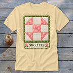 Pale yellow t-shirt with a quilted Shoo Fly block and floral border design.