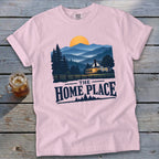 Pink t-shirt with a mountainous landscape, house, and "The Home Place" text.