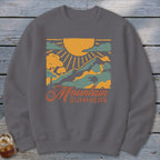 Graphic sweatshirt with "Mountain Summers" text and mountain landscape design.