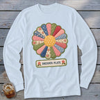 Light blue long-sleeve shirt featuring a colorful Dresden Plate quilt pattern and text.