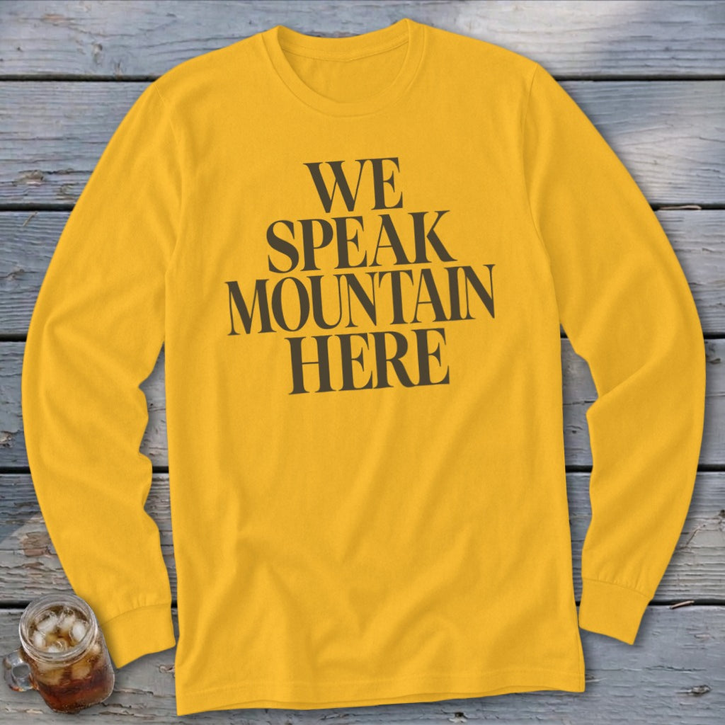 Yellow long-sleeved t-shirt with black text reading "WE SPEAK MOUNTAIN HERE".