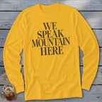 Yellow long-sleeved t-shirt with black text reading "WE SPEAK MOUNTAIN HERE".