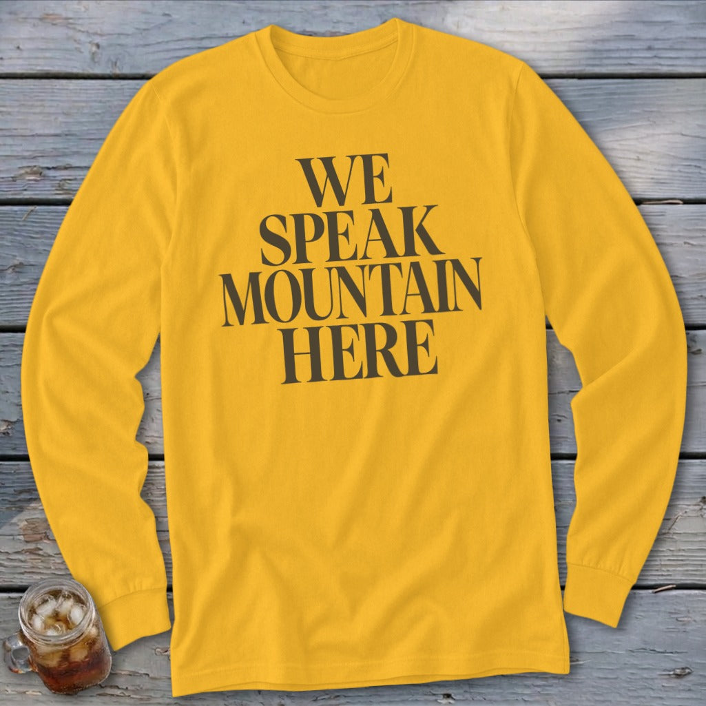 Yellow long-sleeved t-shirt with black text reading "WE SPEAK MOUNTAIN HERE".