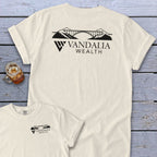 Cream t-shirts with a black graphic of a bridge, mountains, and "Vandalia Wealth" text.