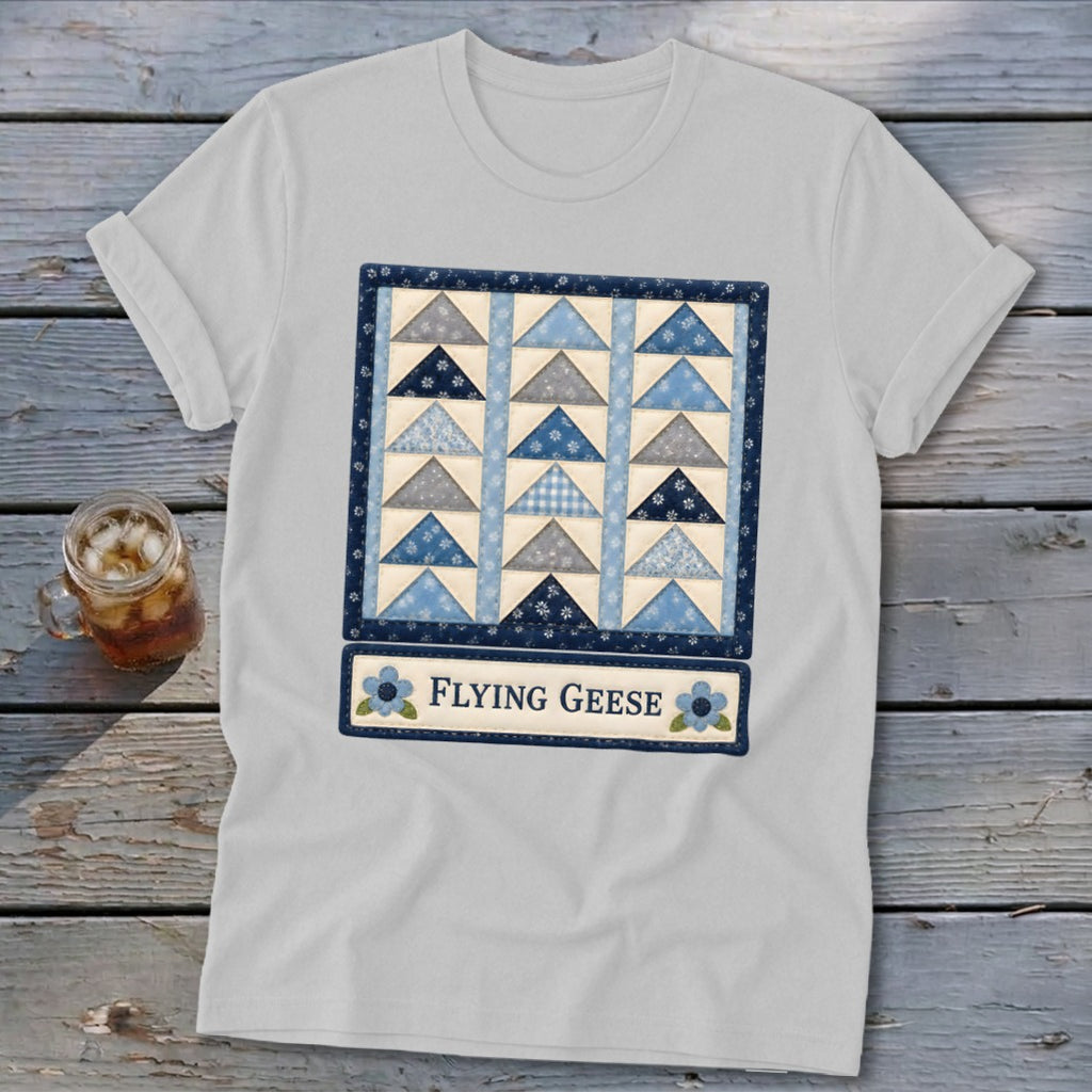 White t-shirt with a "Flying Geese" quilt pattern design and text.
