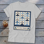 White t-shirt with a "Flying Geese" quilt pattern design and text.