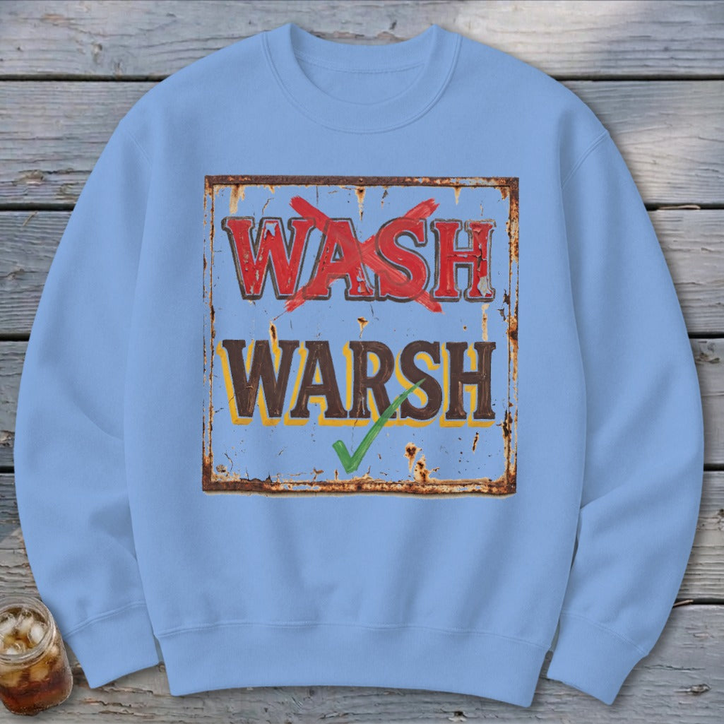 Light blue crewneck sweatshirt featuring a graphic of a rusty sign with the text WASH and WARSH.