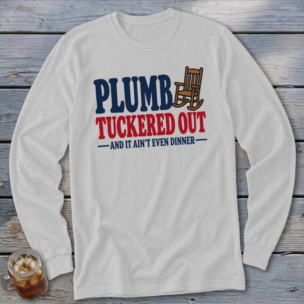 White long-sleeve shirt with "Plumb Tucker Out" and rocking chair graphic.