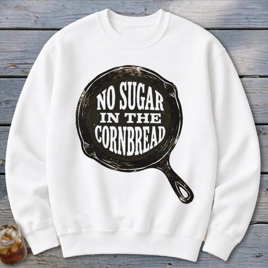 White crewneck sweatshirt with "No Sugar In The Cornbread" text in a skillet graphic.