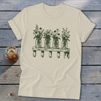 Cream t-shirt with a green graphic of four mason jars filled with wildflowers on a shelf.