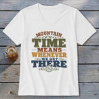 White t-shirt with "Mountain Time Means Whenever We Get There" text and clock graphic.