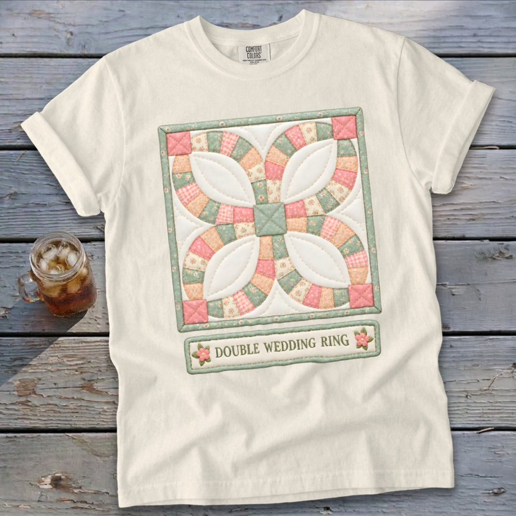 Cream t-shirt with a printed double wedding ring quilt design and text.
