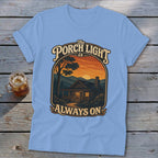 Light blue t-shirt with graphic "The Porch Light Is Always On" and a cabin scene.