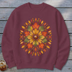Maroon sweatshirt with a circular autumn leaf and acorn design.