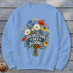 Light blue sweatshirt with floral graphic and "Decoration Day Blooms" text.