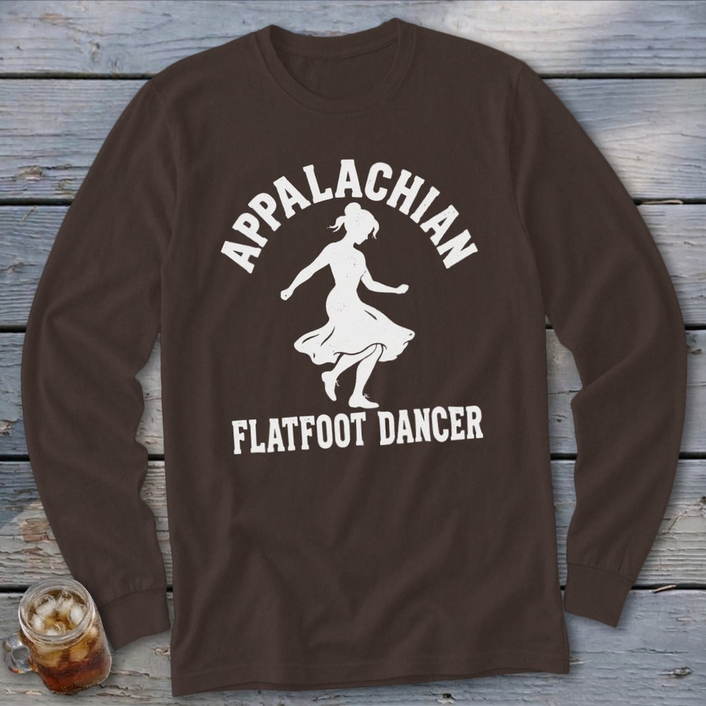 A brown long-sleeve t-shirt with a white graphic of a dancer and the text Appalachian Flatfoot Dancer.