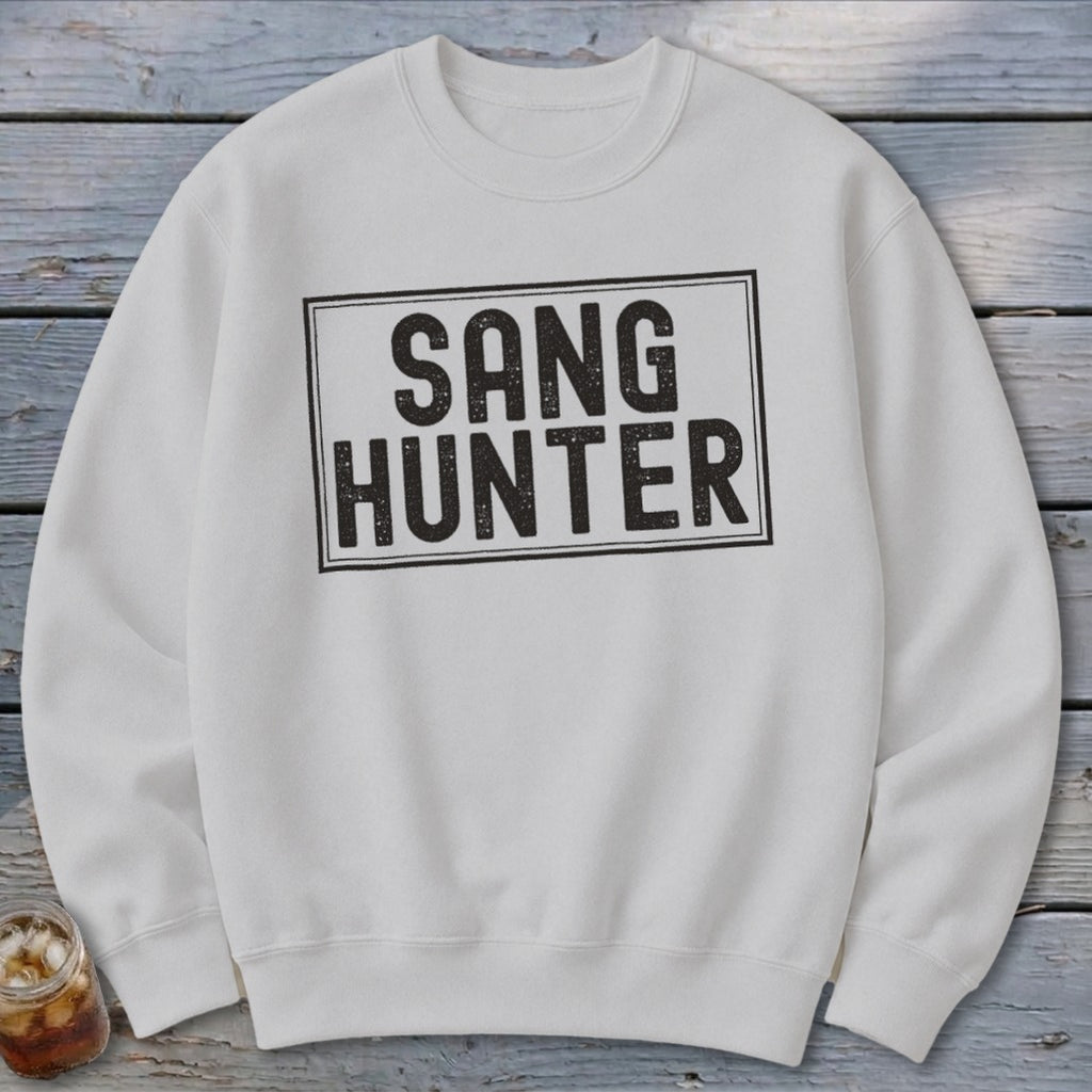 White sweatshirt with black "SANG HUNTER" text in a distressed rectangle.