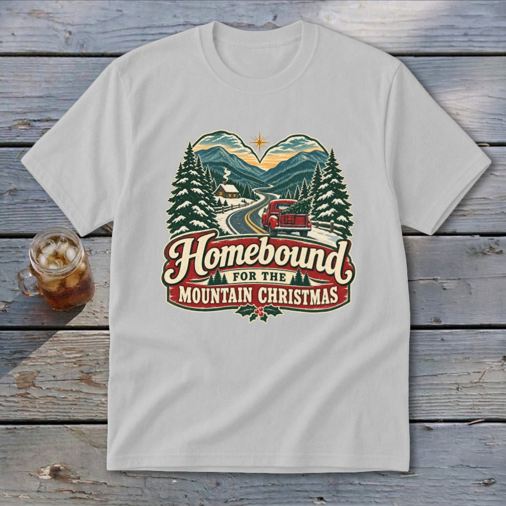 T-shirt graphic with "Homebound for the Mountain Christmas" text, featuring a truck driving home.