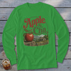 Green long-sleeve t-shirt featuring a graphic of an apple on a wooden post and text reading Apple At Cha.