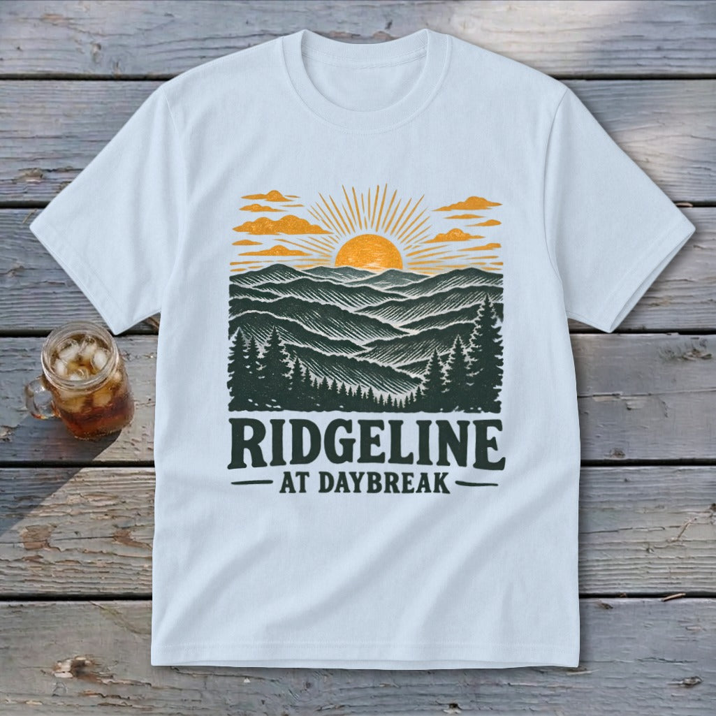 White t-shirt with "RIDGELINE AT DAYBREAK" text and mountain sunrise graphic.