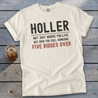 Cream t-shirt with "HOLLER NOT JUST WHERE YOU LIVE BUT HOW YOU CALL SOMEONE FIVE RIDGES OVER" text.