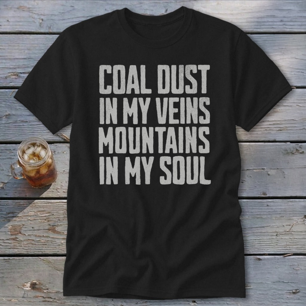 A black t-shirt printed with the white distressed text Coal Dust in My Veins Mountains in My Soul.