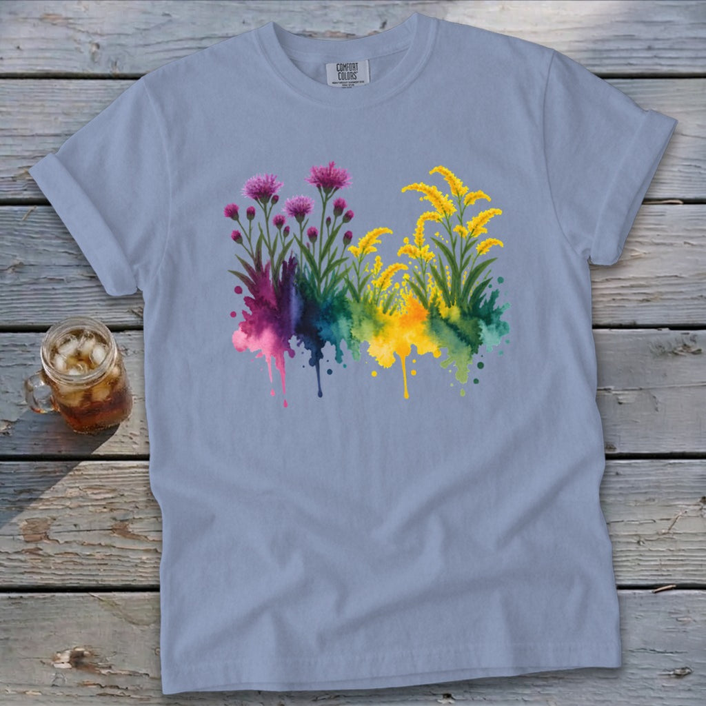 Light blue Comfort Colors t-shirt with watercolor floral design featuring pink and yellow blooms.