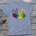 Light blue Comfort Colors t-shirt with watercolor floral design featuring pink and yellow blooms.