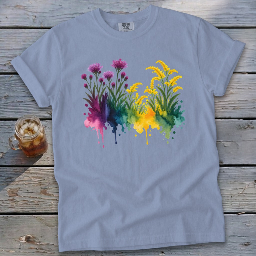 Light blue Comfort Colors t-shirt with watercolor floral design featuring pink and yellow blooms.