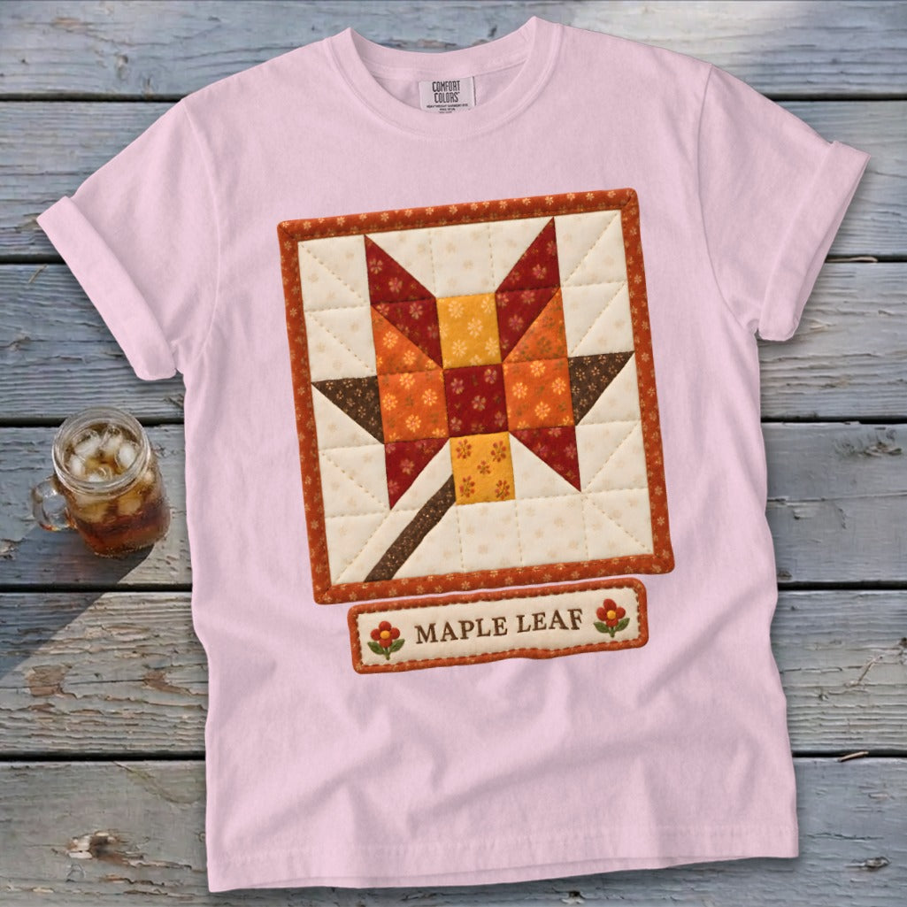 Pink t-shirt with a quilted maple leaf graphic and "Maple Leaf" label.