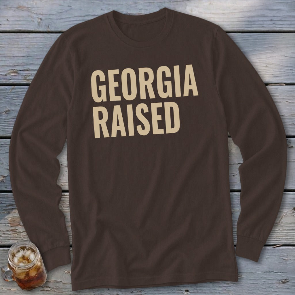 Brown long sleeve shirt with "GEORGIA RAISED" text in beige.